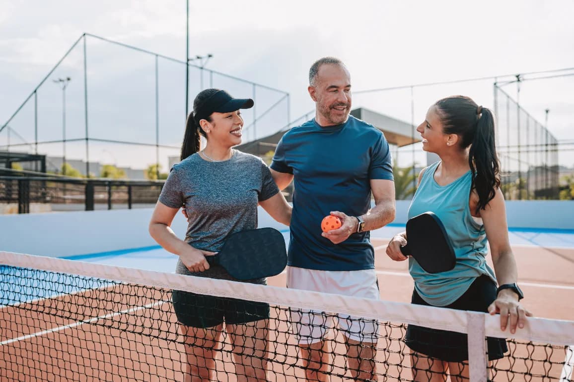 MSUFCU members playing pickleball on an outdoor court